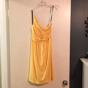 Yellow Calvin Klein one shoulder ruched dress.